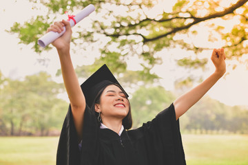 Graduation Concept. Graduated students on graduation day. Asian students are smiling happily on the...