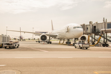 Fototapeta na wymiar Airplane near the terminal in an airport.