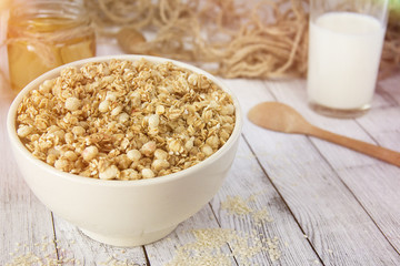 Cooked whole porridge oats in white ceramic bowl.Healthy breakfast.Oatmeal