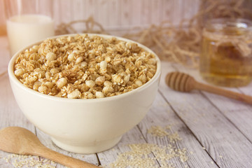 Cooked whole porridge oats in white ceramic bowl.Healthy breakfast.Oatmeal
