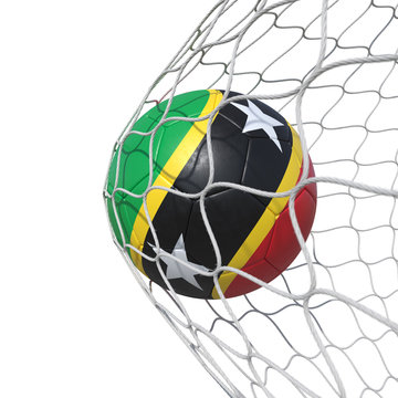 Saint Kitts and Nevis flag soccer ball inside the net, in a net.