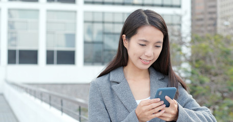 Woman use of cellphone in city