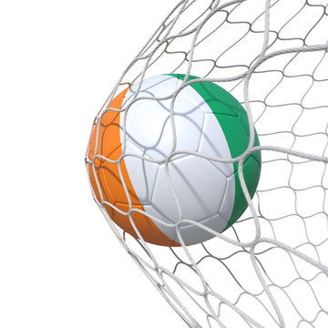 Cote d'Ivoire Ivorian flag soccer ball inside the net, in a net.