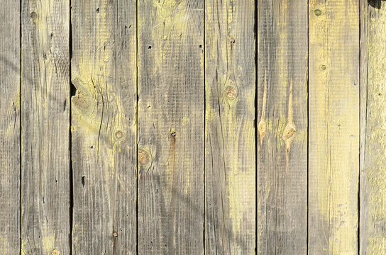 Background from grey and yellow wooden boards with texture