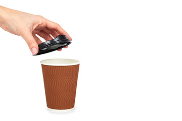 Take out coffee in thermo cup with hand. Isolated on a white background. Disposable container, hot beverage. copy space, template