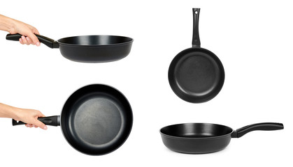 Set of different black fry pans in hand isolated on white background