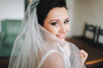 beautiful bride in the room. Morning of the bride. Smiling Bride.