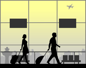 Young couple hurry to their flight, one in the series of similar images silhouette