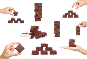 set of different gourmet chocolate candy with hand, isolated on white background, home made sweets,...