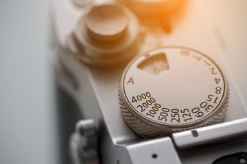 shutter release button and shutter speed dial of vintage camera, shallow depth of field, old film...