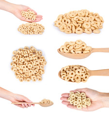 set of different beige rings corn flakes with hand, isolated on white background