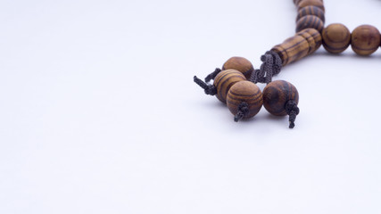 Closeup of  tasbih or rosary on a white background. Selective focus and copy space.