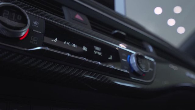 Modern car interior, view of car control panel, smooth camera movement.
