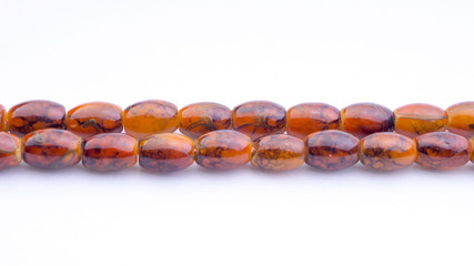 Closeup of  tasbih or rosary on a white background. Selective focus and copy space.