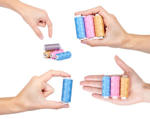set of different spool of thread with hand, isolated on white background