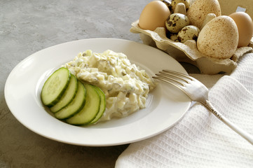 Traditional American egg salad on grey background.