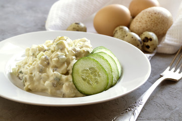 Traditional American egg salad on grey background.