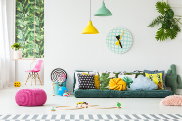 Pink pouf in bright interior