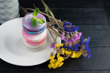 Macaroons with flowers. Close up macaroons.