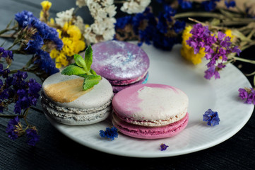 Macaroons with flowers. Close up macaroons.