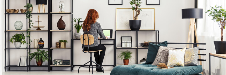 Woman sitting by the desk