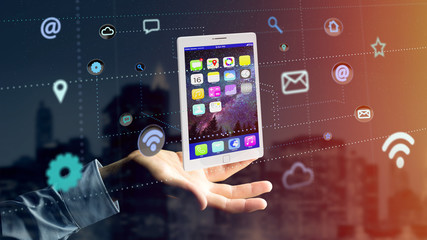 Businessman holding a tablet surrounding by app and social icon - 3d render