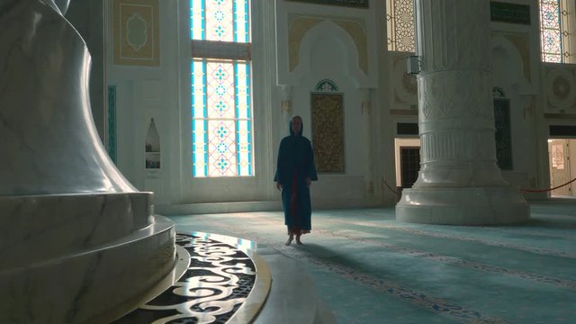 Woman coming for prayer in mosque