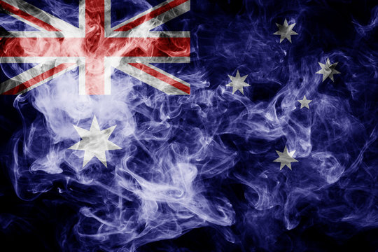 National flag of Australia from thick colored smoke on a black isolated background