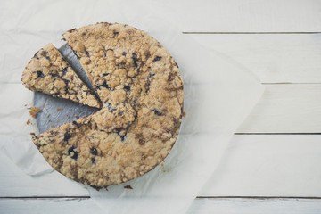 Berries cheesecake coffee cake on wooden table. Horizontal.
