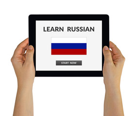Hands holding digital tablet computer with learn Russian concept on screen. Isolated on white. All...