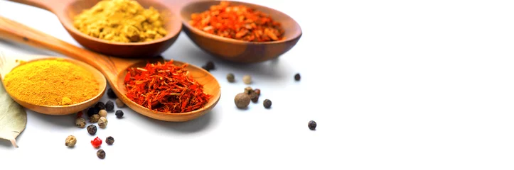 Printed roller blinds Herbs Spice. Various spices in wooden spoons over white background. Curry, saffron, turmeric, cinnamon