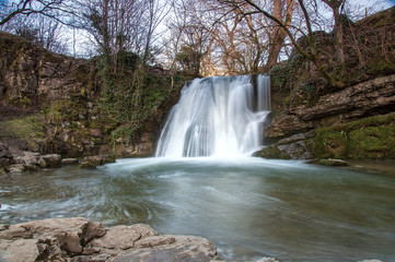 Water flowing over a waterfall at Janet's Foss in Yorkshire