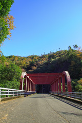 Red iron bridge at Hozukyo in Kyoto, Japan