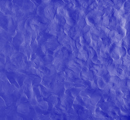 Blue background with fingerprints made from plasticine.