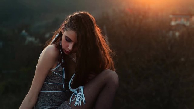 Sensual girl at the sunset. Beauty romantic girl outdoors. beautiful woman in sun light. Blowing long hair. Autumn. Glow sun, sunshine. Backlight. Subculture. Emo girl. Postapocalypse girl. Steampunk.