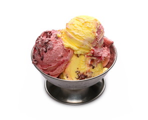 Raspberry and vanilla ice cream balls, scoops with chocolate shavings in metal bowl isolated on white background