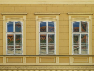 Three windows with reflection