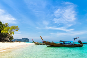 Naklejka na ściany i meble Amazing view of beautiful beach with traditional thailand longtale boat. Location: Bamboo island, Krabi province, Thailand, Andaman Sea. Artistic picture. Beauty world.