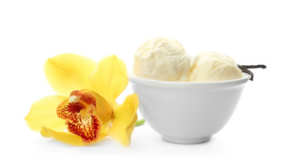 Bowl with delicious vanilla ice cream and flower on white background