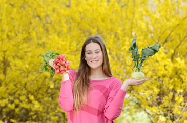 Beautiful attractive young woman holding healthy detox vegetable. Healthy lifestyle concept.