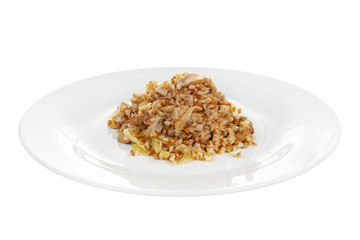 Buckwheat with onions and mushrooms fried, baked, cooked portion of side dish on a plate on white isolated background Side view. Appetizing dish for the menu restaurant, bar, cafe