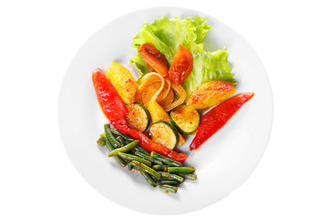 Vegetables grilled portion of side dish on a plate on white isolated background view from above. Appetizing dish for the menu restaurant, bar, cafe