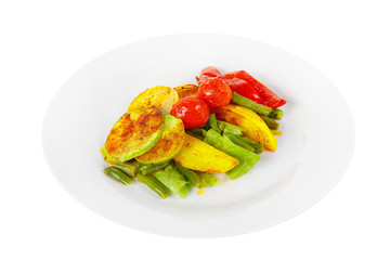 Vegetables grilled portion of side dish on a plate on white isolated background Side view. Appetizing dish for the menu restaurant, bar, cafe