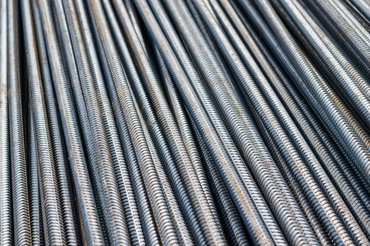 Steel rods bars,  metal rebar construction, can be used to reinforce concrete, close-up, selective focus