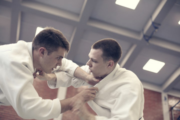 Judo class between two men.