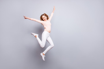 Fototapeta premium People emotion expressing feeling good mood person concept. Full-size portrait of excited cheerful joyful rejoicing delightful pretty woman jumping up showing v-sign isolated on gray background