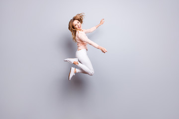 Fototapeta premium Trousers sneakers pants white pose rejoice exams pass people person concept. Full-size portrait of charming excited crazy mad manager jumping up isolated on gray background copy-space