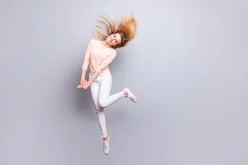 Gordijnen Beauty fashion romantic people person emotion feelings expressing concept. Full-length full-size portrait of excited careless lovely sweet adorable pretty lady jumping up isolated on gray background © deagreez