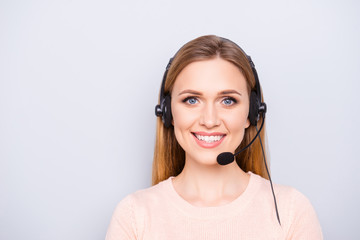 Close up portrait of cheerful smart clever confident focused pretty responsive expert experienced charming operator with toothy smile using headphones isolated on gray background - obrazy, fototapety, plakaty