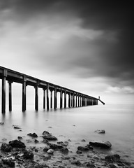 jetty seascape in black and white